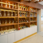 Wooden shelves stocked with products at CannaBuri