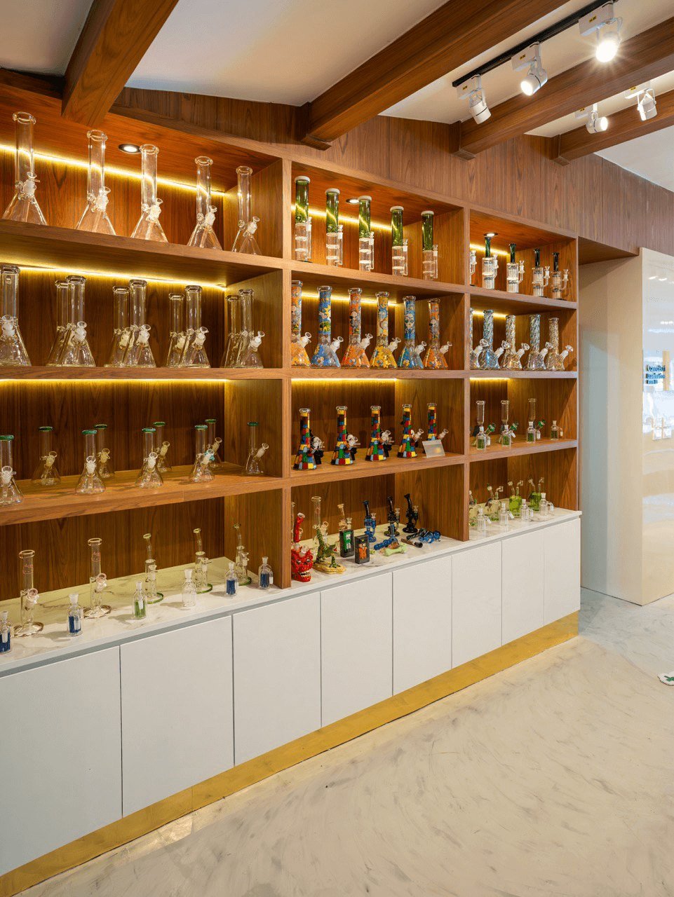Wooden shelves stocked with products at CannaBuri