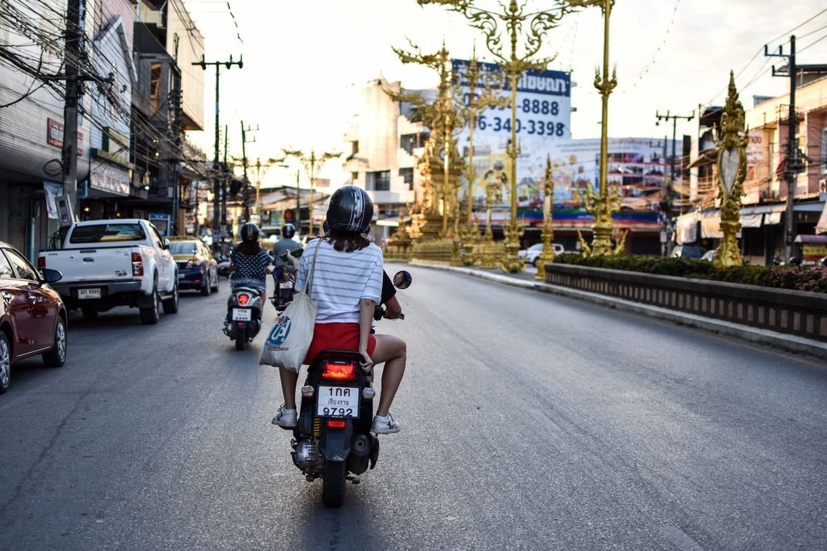 Motorbike riders on a Thai street